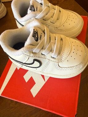 Nike Kids White Sneakers with Black Swoosh